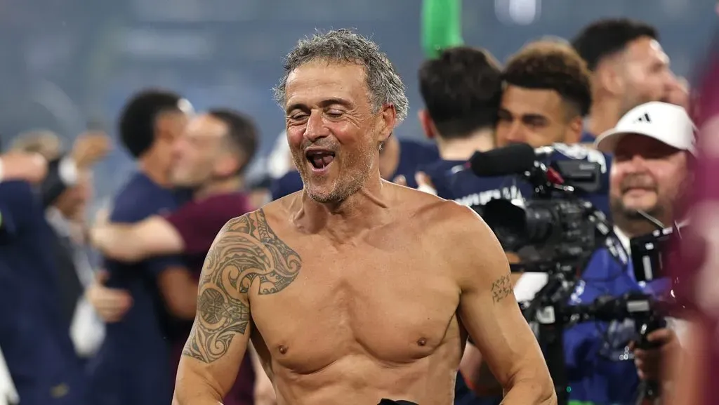 MUNICH, GERMANY – MAY 31: Luis Enrique, Head Coach of Paris Saint-Germain, holds his t-shirt after removing it whilst celebrating victory after the UEFA Champions League Final 2025 between Paris Saint-Germain and FC Internazionale Milano at Munich Football Arena on May 31, 2025 in Munich, Germany. (Photo by Lars Baron/Getty Images)